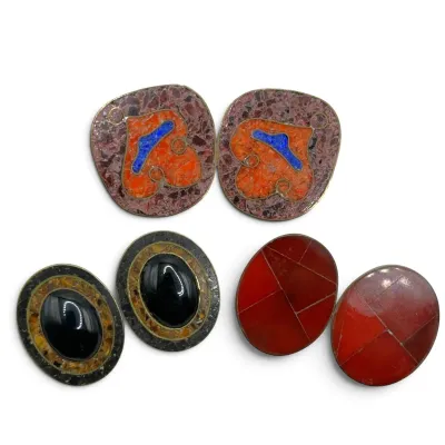Sale Photo Thumbnail #131: Three pairs of vintage Mexican clip-on earrings, featuring colorful stone inlay and mosaic designs in mid-century modernist styles.
