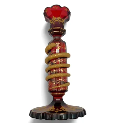 Sale Photo Thumbnail #43: Bohemian ruby cut-to-clear glass candlestick featuring a coiled snake detail and intricate gold-painted floral accents.