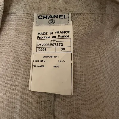 Sale Photo Thumbnail #171: Chanel clothing label on a linen blend garment, indicating size 38 and made in France, from the 1999 Spring collection.