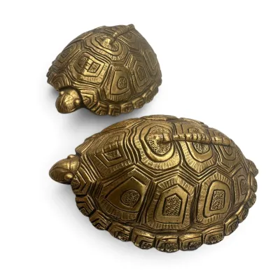 Sale Photo Thumbnail #82: Pair of vintage brass turtle figurines with detailed shell patterns and a warm, aged patina.