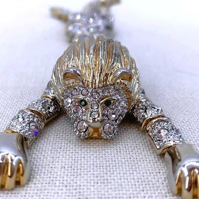 Sale Photo Thumbnail #259: Large Sparkling Vintage Golden Mane Green Eyed Articulated Pave Rhinestone Lion Shoulder Brooch
