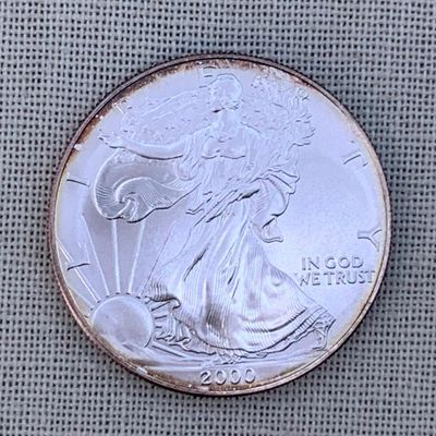 Sale Photo Thumbnail #106: Toned Brilliant Uncirculated 2000 American Eagle Silver Dollar Coin