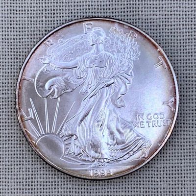Sale Photo Thumbnail #30: Toned Brilliant Uncirculated 1994 American Eagle Silver Dollar Coin