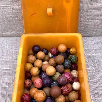 Sale Photo Thumbnail #57: 100 Antique Clay Marbles in Art Deco Tourneur Lidded Butterscotch Bakelite Box