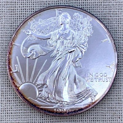 Sale Photo Thumbnail #46: Toned Brilliant Uncirculated 1997 American Eagle Silver Dollar Coin