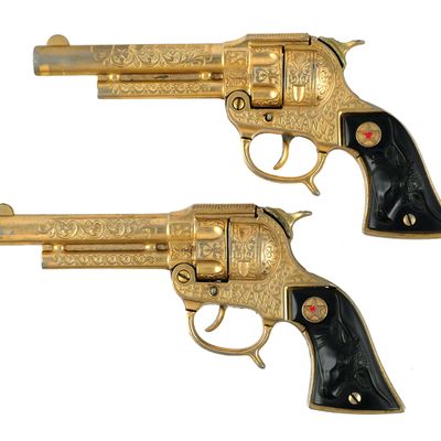 Sale Photo Thumbnail #299: (2) Hubley Texan Jr. Gold Cap Guns & Holsters