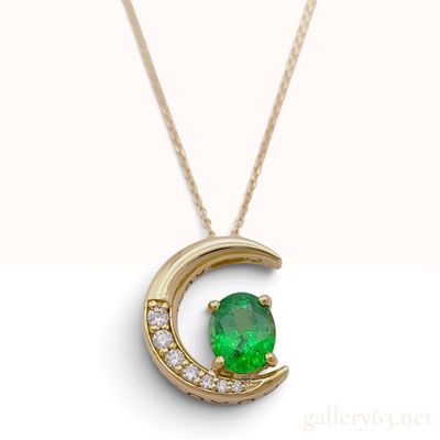 Sale Photo Thumbnail #470: An 18 Karat Yellow Gold 1.35ct Tsavorite Garnet and 0.11ctw Diamond Crescent Moon Pendant Necklace