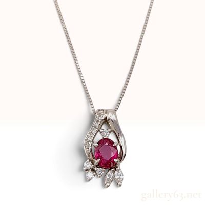 Sale Photo Thumbnail #515: A Platinum 900 and 0.15ctw Diamond Pendant with Oval Ruby on a Platinum 850 Box Chain