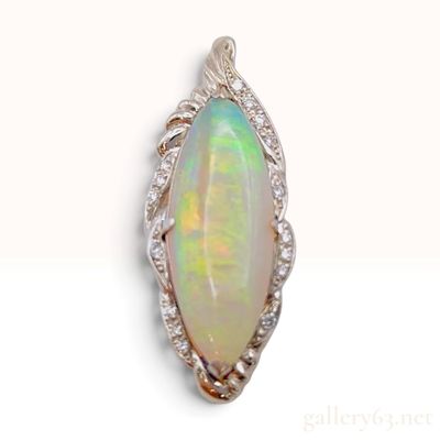 A Platinum 4.06ct Opal and 0.13ctw Diamond Foliate Marquise Pendant