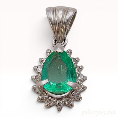 Sale Photo Thumbnail #595: A Platinum Pear-Cut Emerald and Diamond Halo Pendant