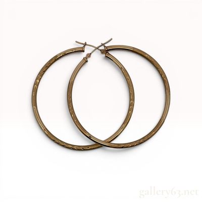 Sale Photo Thumbnail #168: A Pair of 10 Karat Yellow Gold Patterned Hoop Earrings