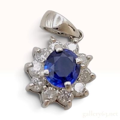 Sale Photo Thumbnail #363: A Platinum Blue Sapphire and Diamond Halo Cluster Pendant