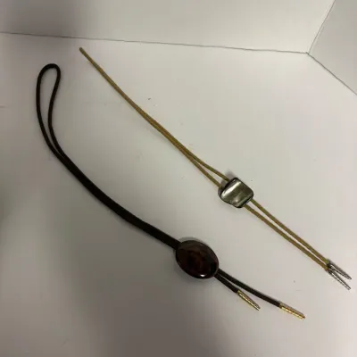 Sale Photo Thumbnail #54: Two vintage bolo ties.