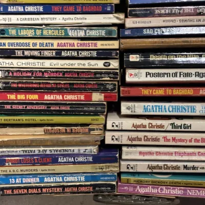 Sale Photo Thumbnail #43: A collection of vintage Agatha Christie paperback books, showing worn spines with various titles from publishers like Dell, Pocket Books, and Bantam.