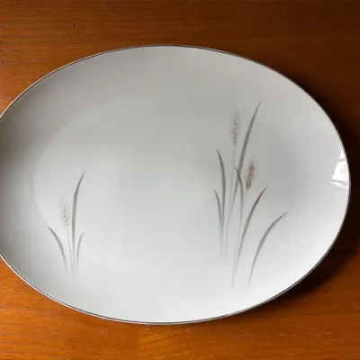 Sale Photo Thumbnail #31: Mid-century modern oval serving platter featuring a delicate wheat stalk motif.
