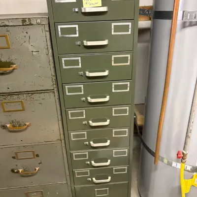 Sale Photo Thumbnail #18: Vintage  Feathertouch nine-drawer olive green metal filing cabinet with silver-tone pulls and label holders.