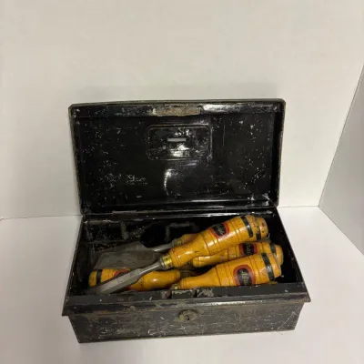 Sale Photo Thumbnail #24: Vintage metal cash box containing a set of wood chisels.