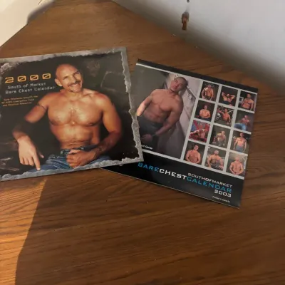 Sale Photo Thumbnail #40: Two vintage South of Market Bare Chest Calendars from the years 2000 and 2003, featuring male models.