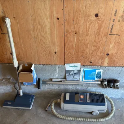 Sale Photo Thumbnail #12: Vintage Electrolux Ultralux canister vacuum cleaner with hose, power nozzle, extension wands, various attachments, and original manuals.