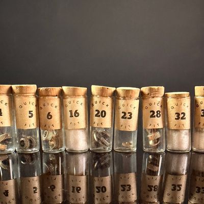 Sale Photo Thumbnail #68: An Assortment of Vintage Quick Fit Watch Winding Crowns in Numbered Glass Vials