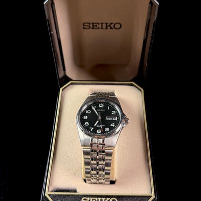 Sale Photo Thumbnail #80: Seiko Stainless Steel Quartz Day/Date Field Watch Reference 7N43-8329