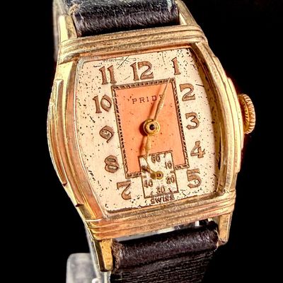 Sale Photo Thumbnail #129: Vintage Pride Manual Wind Two Tone Salmon Dial Tonneau Wristwatch