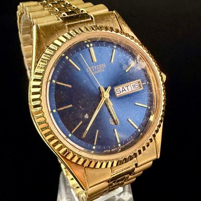 Sale Photo Thumbnail #97: Citizen Quartz Day-Date Gold-Tone Wristwatch with Blue Dial