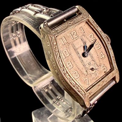 Sale Photo Thumbnail #155: Roric Swiss Manual Wind Art Deco Engraved Tonneau Wristwatch