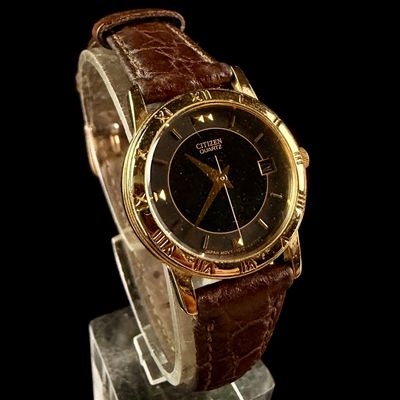 Sale Photo Thumbnail #38: Citizen Quartz Gold Toned Base Metal Wristwatch with Date