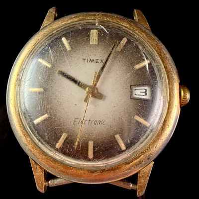 Sale Photo Thumbnail #32: Timex Electronic Gold-Tone Date Wristwatch
