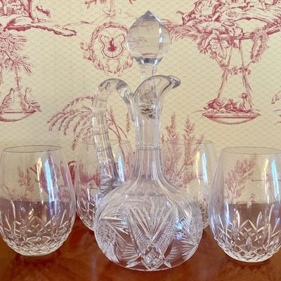 A Set of Cut Crystal Stemless Tumblers and a Handled Claret Jug