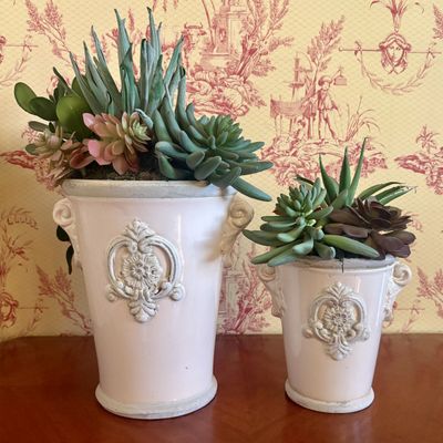 A Pair of Glazed Ceramic Urn Form Planters with Faux Succulents