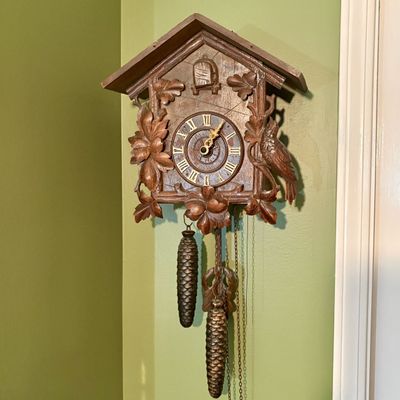 Carved Wood Black Forest Cuckoo Wall Clock with Bird and Leaf Decoration