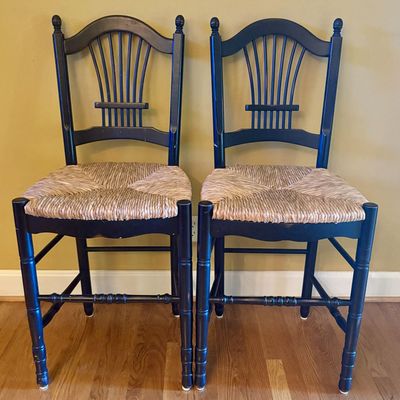 A Pair of Black Painted Wood Counter Height Stools with Rush Seats