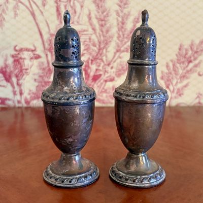 A Pair of J. Rogers Sterling Silver Weighted Salt and Pepper Shakers