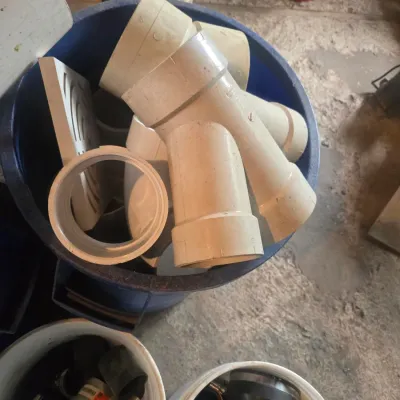 Assorted PVC pipe fittings and plumbing connectors