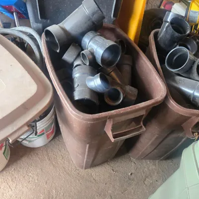 Assorted black PVC pipe fittings and connectors s