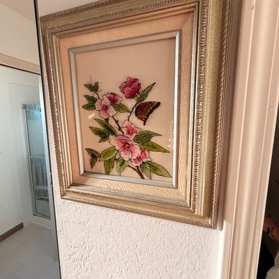 Sale Photo Thumbnail #47: Framed floral and butterfly artwork, featuring pink blossoms and a butterfly in an ornate gold-finished frame.