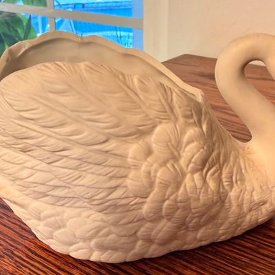 Sale Photo Thumbnail #84: Vintage white bisque ceramic swan planter featuring detailed feather textures.