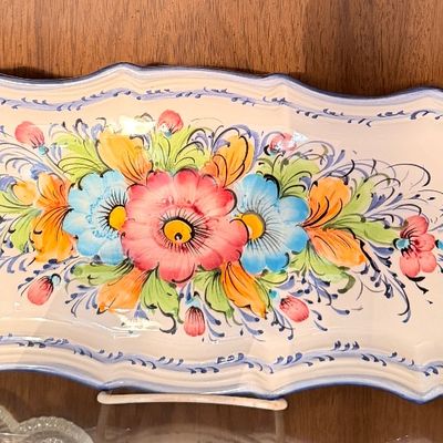 Sale Photo Thumbnail #113: Hand-painted ceramic serving tray featuring colorful floral motifs and integrated side handles.