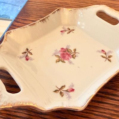 Sale Photo Thumbnail #60: Vintage porcelain handled serving tray with delicate pink rose motifs and gilded scalloped edges.