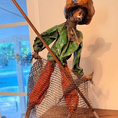 Sale Photo Thumbnail #58: Vintage Mexican papier-mâché figurine of a fisherman holding a net and pole, mounted on a wooden base.
