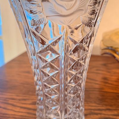 Sale Photo Thumbnail #107: Vintage pressed crystal vase featuring a frosted rose motif near the scalloped rim and deep diamond-cut geometric patterns along the body.