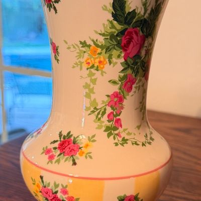 Sale Photo Thumbnail #93: Pioneer Woman floral ceramic vase featuring a pedestal base and yellow accent trim.