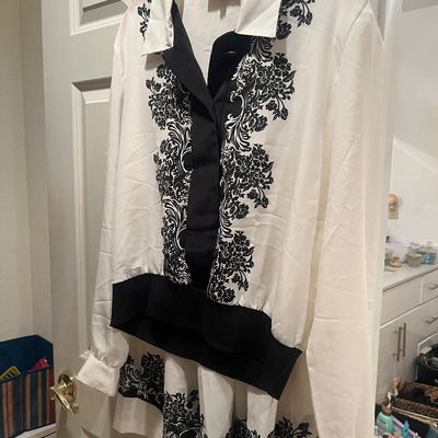 Vintage white long-sleeve blouse and matching skirt set by Mod-On-Girl featuring black damask floral embroidery and a banded hem.