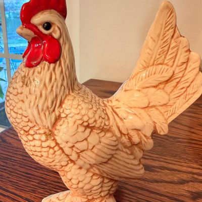 Sale Photo Thumbnail #90: Vintage molded ceramic rooster figurine with a hand-painted bright red comb and wattle, featuring detailed feather textures.