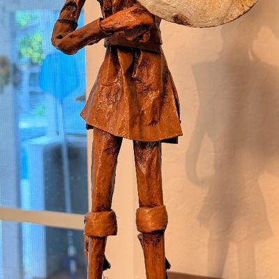 Sale Photo Thumbnail #59: Handcrafted papier-mâché or leather sculpture depicting Don Quixote holding a shield, mounted on a wooden base.
