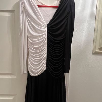 Vintage 1980s color-block black and white long-sleeve dress featuring a gathered, ruched bodice and a full black skirt.