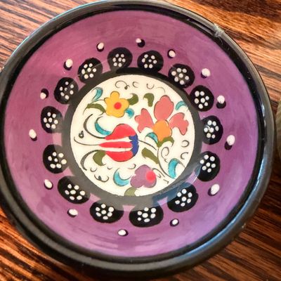 Sale Photo Thumbnail #101: Hand-painted Turkish ceramic trinket bowl featuring a vibrant purple border and a floral center design.