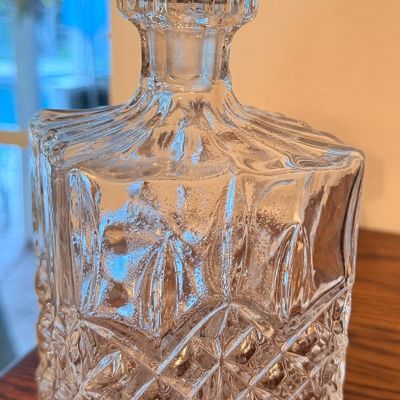 Sale Photo Thumbnail #73: Vintage heavy cut lead crystal liquor decanter with matching faceted stopper and diamond pattern detailing.